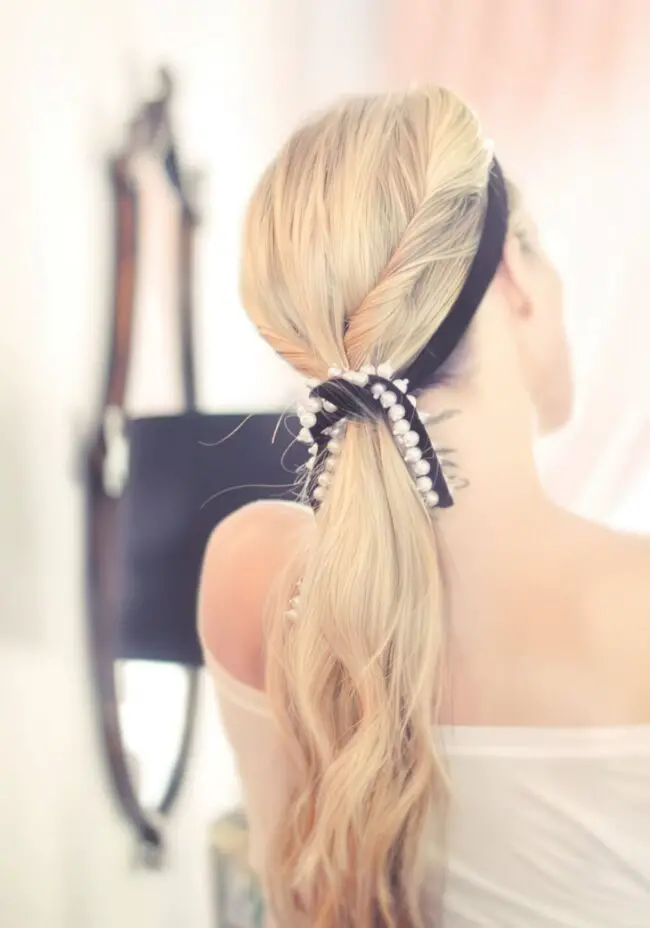 Pearl-Adorned Ponytail with Blonde Highlights